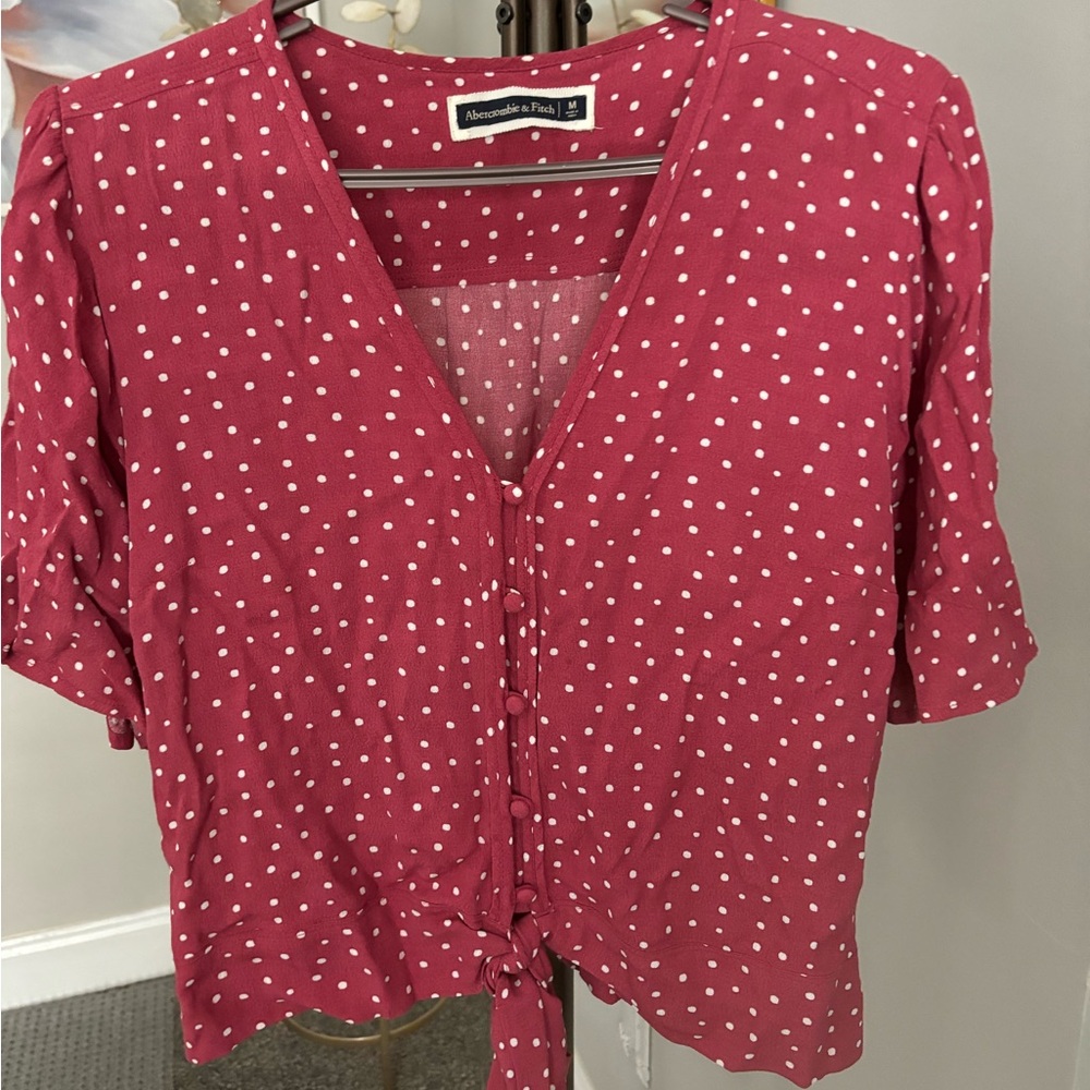 Reddish pink polka dot button down blouse. Ties at waist. Adorable!